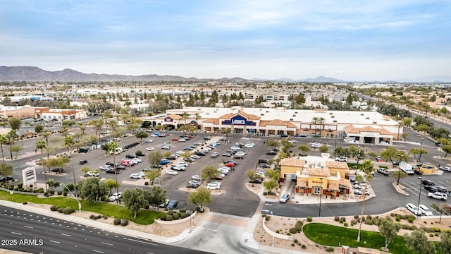 birds eye view of property with a mountain view