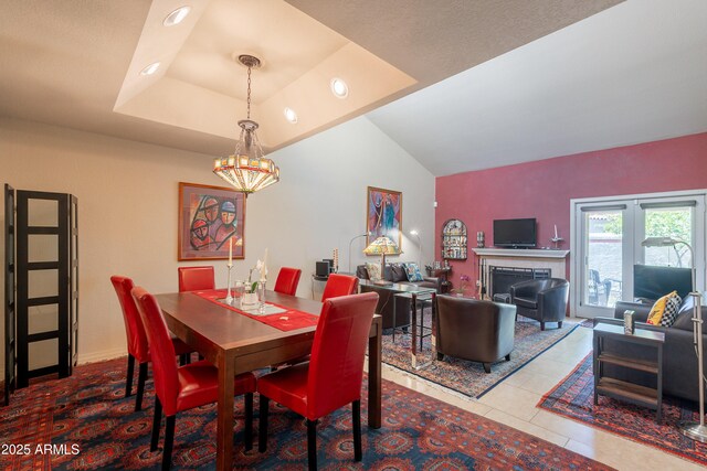 2413 E Rancho Dr, Phoenix, AZ 85016 - dining room with a chandelier, a raised ceiling, tile patterned flooring, vaulted ceiling, and recessed lighting