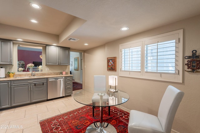 2413 E Rancho Dr, Phoenix, AZ 85016 - kitchen featuring dishwasher, a sink, gray cabinets, light countertops, and recessed lighting