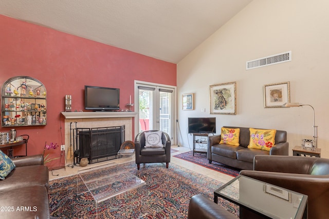 2413 E Rancho Dr, Phoenix, AZ 85016 - tiled living area with high vaulted ceiling and a tiled fireplace
