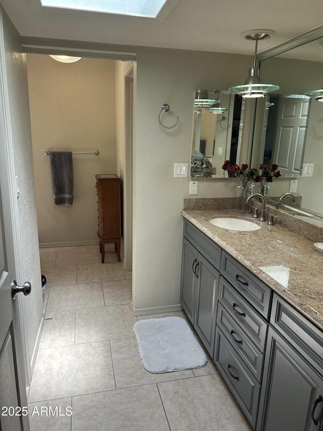 2413 E Rancho Dr, Phoenix, AZ 85016 - bathroom with vanity, tile patterned flooring, and baseboards
