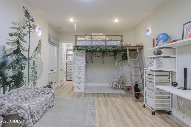 bedroom with light wood-type flooring