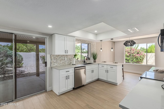 5526 N 77th Way, Scottsdale, AZ 85250 - kitchen featuring stainless steel appliances, a peninsula, light wood-style floors, white cabinetry, and recessed lighting