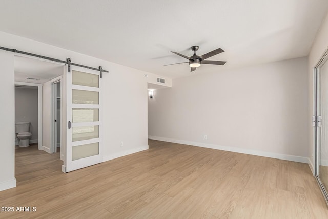 5526 N 77th Way, Scottsdale, AZ 85250 - unfurnished room with ceiling fan, baseboards, and light wood-style flooring