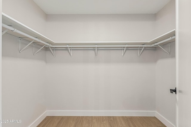 5526 N 77th Way, Scottsdale, AZ 85250 - spacious closet featuring wood finished floors