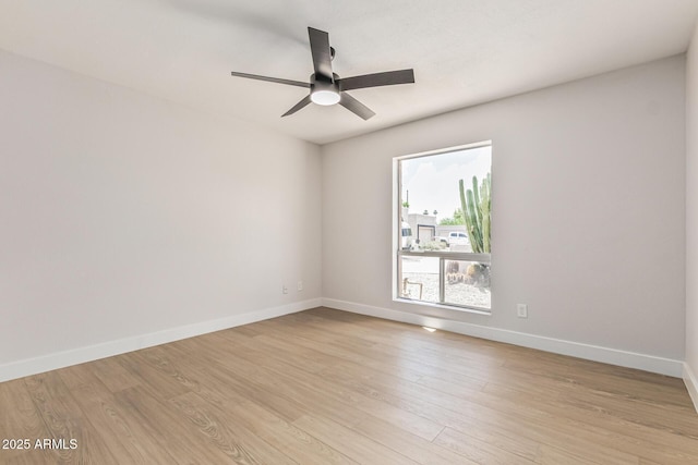 5526 N 77th Way, Scottsdale, AZ 85250 - spare room with ceiling fan, light wood-type flooring, and baseboards