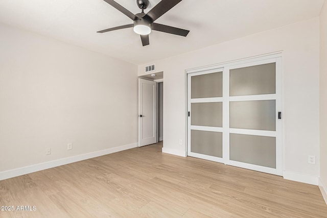 5526 N 77th Way, Scottsdale, AZ 85250 - spare room with ceiling fan, light wood-style flooring, and baseboards