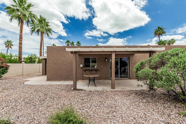 5526 N 77th Way, Scottsdale, AZ 85250 - rear view of property with stucco siding and a patio