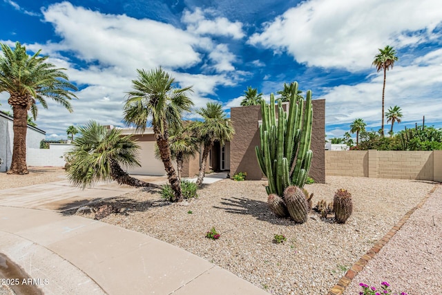 5526 N 77th Way, Scottsdale, AZ 85250 - view of front facade with concrete driveway, a garage, and stucco siding