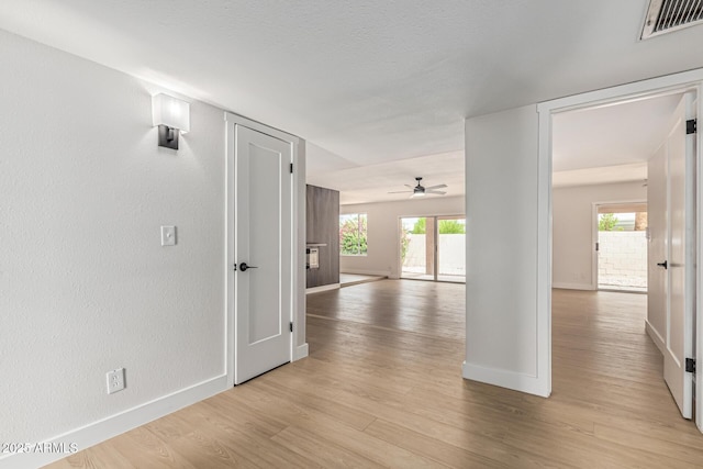 5526 N 77th Way, Scottsdale, AZ 85250 - hallway with baseboards, light wood finished floors, and healthy amount of natural light