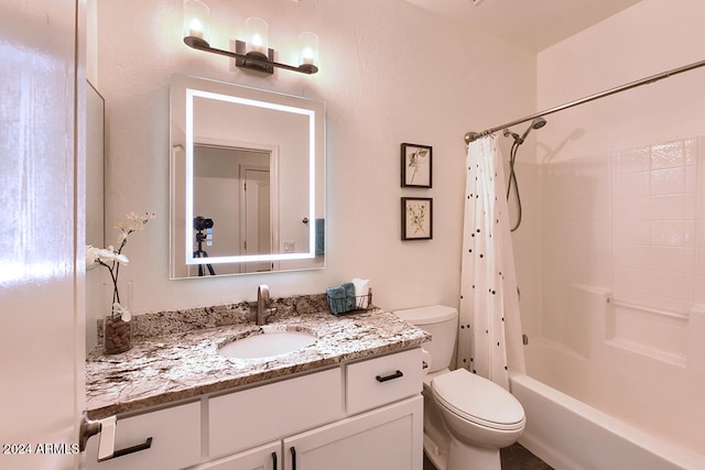 full bathroom featuring vanity, toilet, and shower / tub combo with curtain