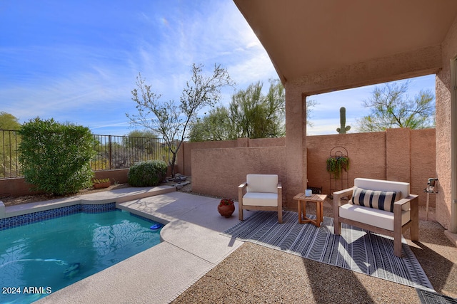 view of swimming pool with a patio