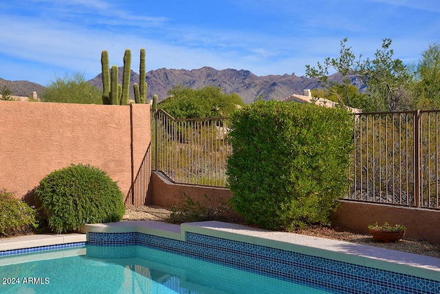 view of pool featuring a mountain view