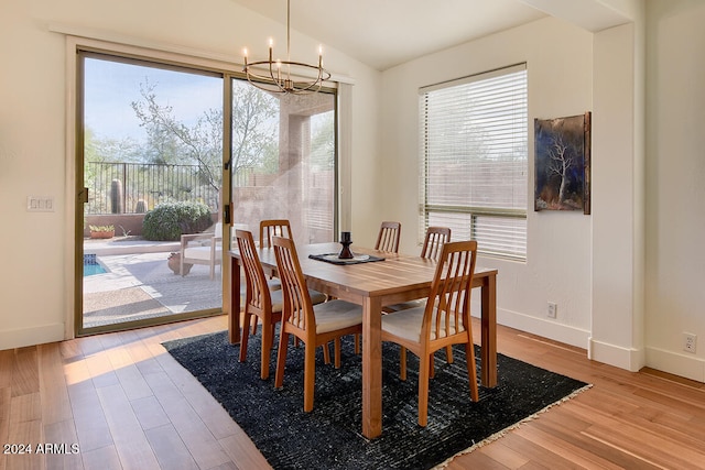 dining room with a wealth of natural light and light hardwood / wood-style floors