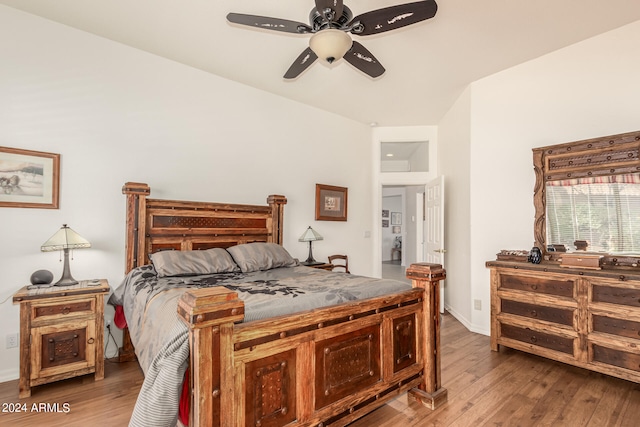 bedroom featuring hardwood / wood-style flooring and ceiling fan