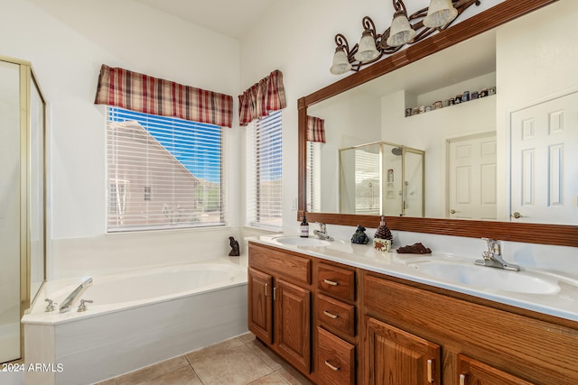 bathroom featuring tile floors, double vanity, and separate shower and tub