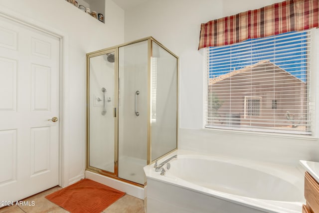 bathroom featuring vanity, tile floors, and separate shower and tub