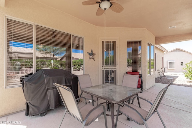 view of terrace with ceiling fan and grilling area