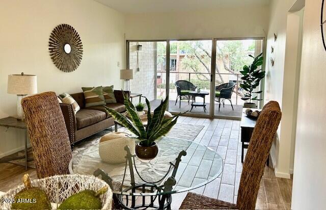 living room featuring baseboards and wood finished floors