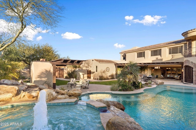 view of pool with an in ground hot tub and a patio