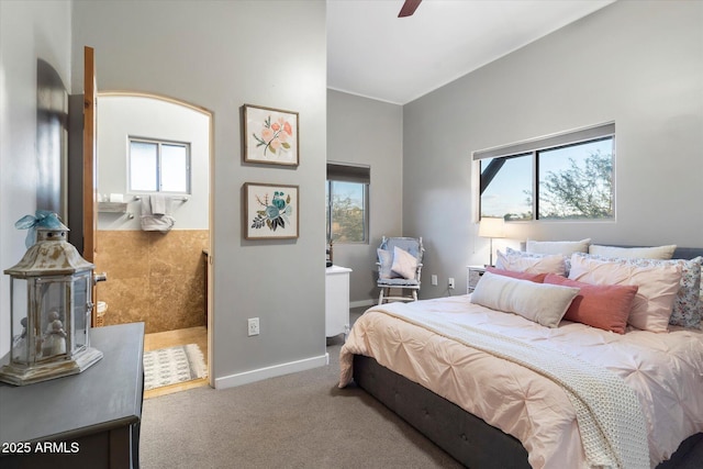 bedroom featuring carpet flooring, ceiling fan, and multiple windows