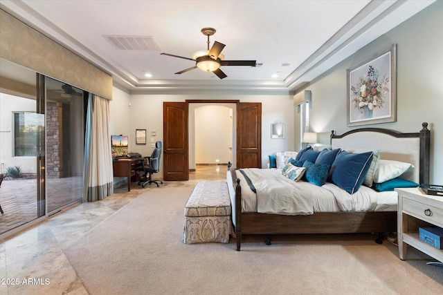 bedroom with access to outside, a raised ceiling, and ceiling fan