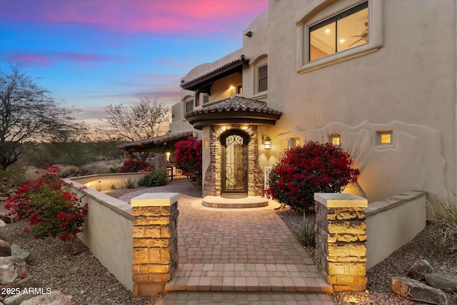 view of patio terrace at dusk