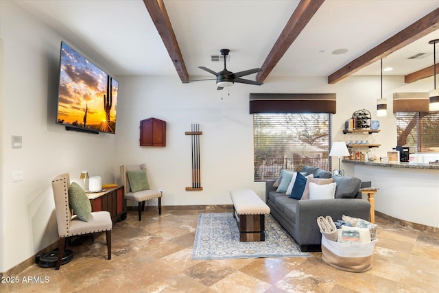 living room with beamed ceiling and ceiling fan