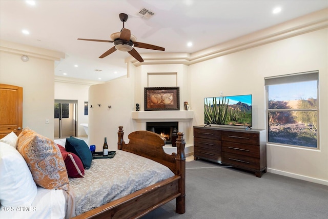 carpeted bedroom with ceiling fan, ornamental molding, and connected bathroom