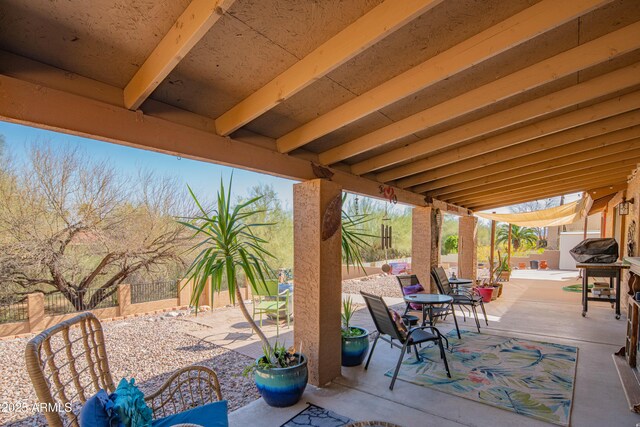 view of patio featuring fence