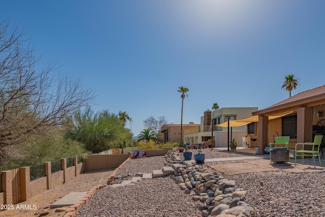 view of yard with a patio and fence