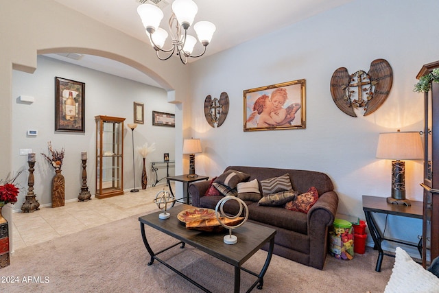 living room with an inviting chandelier and light carpet