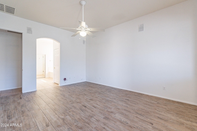 spare room featuring light wood-type flooring and ceiling fan