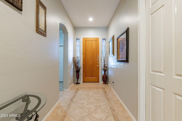 hall with light tile patterned flooring