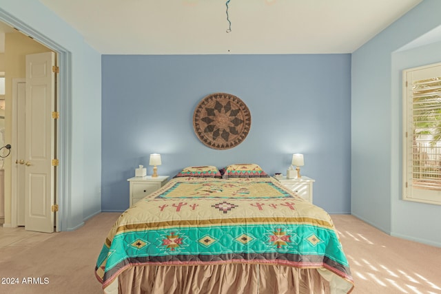 bedroom with light colored carpet