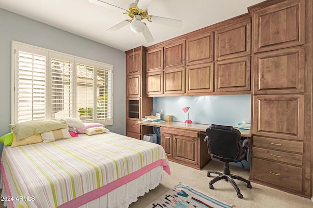 bedroom with ceiling fan and light colored carpet