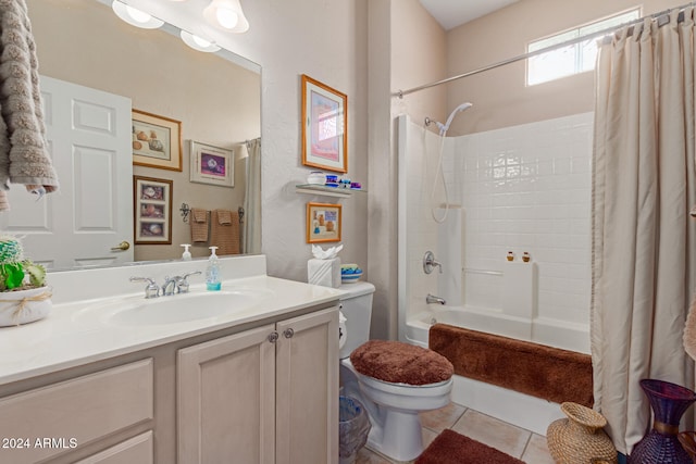 full bathroom featuring toilet, vanity, tile patterned floors, and shower / bath combo with shower curtain