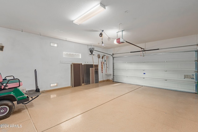 garage featuring a garage door opener