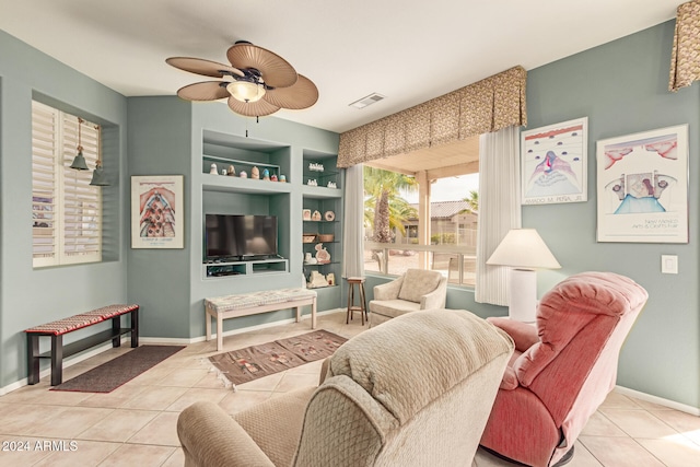 living room with ceiling fan, light tile patterned flooring, and built in features