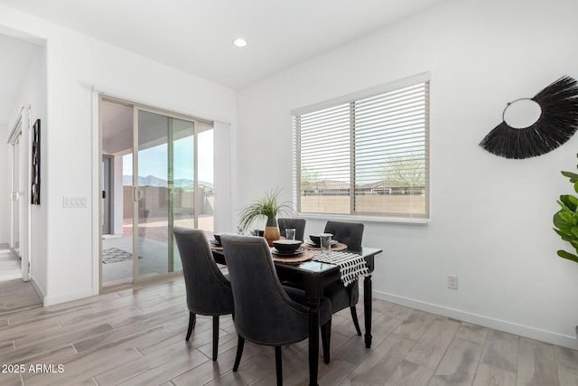 3089 N 200th Ave, Buckeye, AZ 85396 - dining room with light wood finished floors, baseboards, and recessed lighting