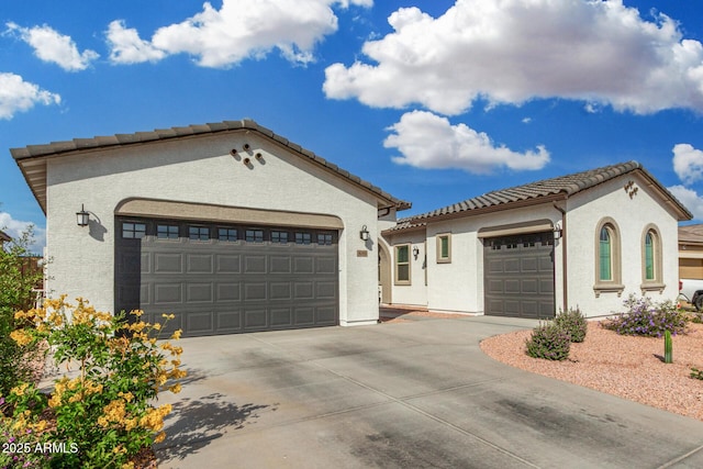 3089 N 200th Ave, Buckeye, AZ 85396 - mediterranean / spanish-style home with a tiled roof, concrete driveway, and stucco siding
