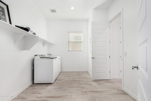3089 N 200th Ave, Buckeye, AZ 85396 - washroom with washer and clothes dryer, light wood finished floors, recessed lighting, and baseboards