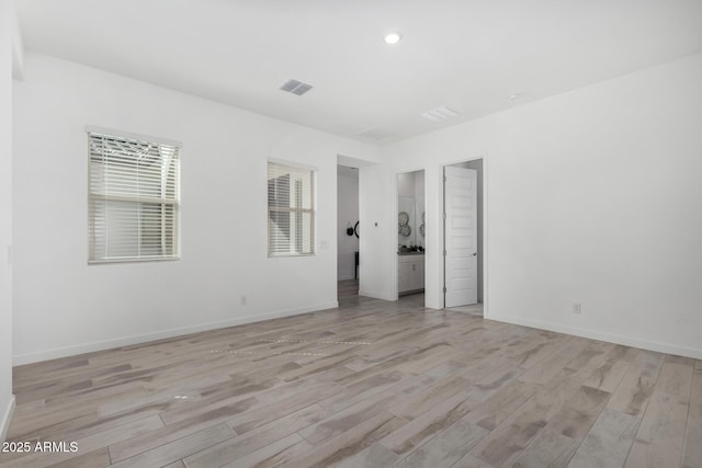 3089 N 200th Ave, Buckeye, AZ 85396 - spare room featuring light wood-style flooring, baseboards, and recessed lighting