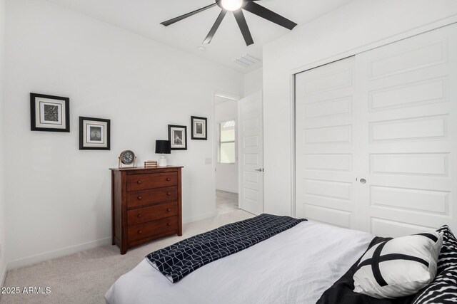 3089 N 200th Ave, Buckeye, AZ 85396 - bedroom featuring light carpet, a closet, ceiling fan, and baseboards