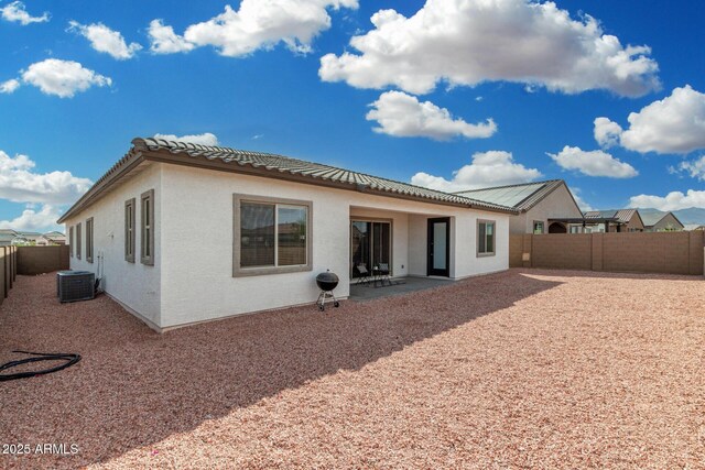 3089 N 200th Ave, Buckeye, AZ 85396 - rear view of house with a fenced backyard, a patio area, central AC, and stucco siding