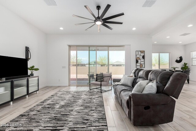 3089 N 200th Ave, Buckeye, AZ 85396 - living room with a ceiling fan, light wood-style flooring, recessed lighting, and baseboards