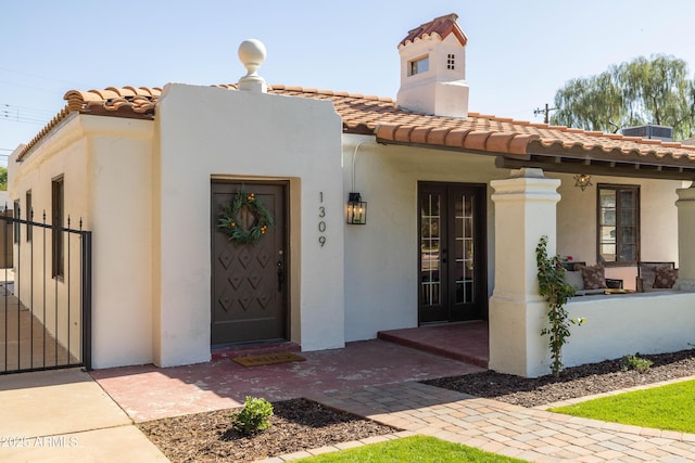 1309 W Lynwood St, Phoenix, AZ 85007 - view of front of home with a tile roof, stucco siding, and fence