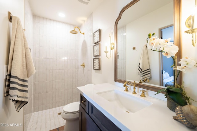 1309 W Lynwood St, Phoenix, AZ 85007 - bathroom featuring a tile shower, vanity, and toilet