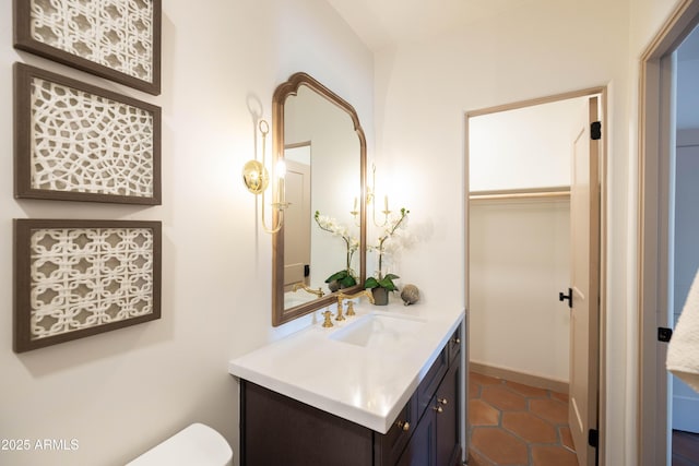 1309 W Lynwood St, Phoenix, AZ 85007 - half bathroom featuring vanity, toilet, and tile patterned floors