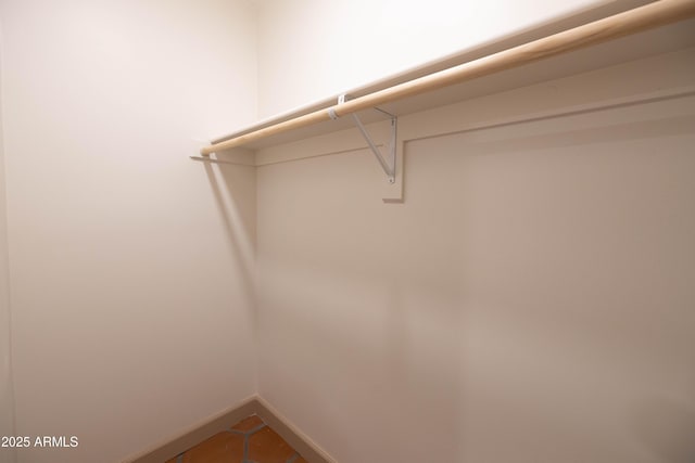 1309 W Lynwood St, Phoenix, AZ 85007 - spacious closet featuring tile patterned floors